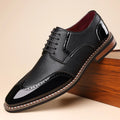 Men's black pointed toe PU leather low-top business casual shoes on white background