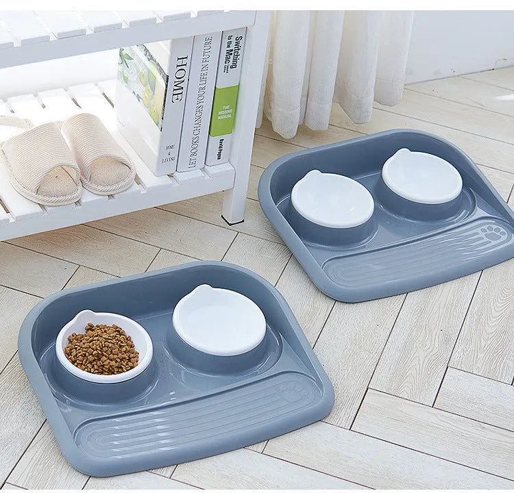 Double plastic pet bowl in grey, blue, green, or pink, measuring 45x35x8cm with anti-skid base.