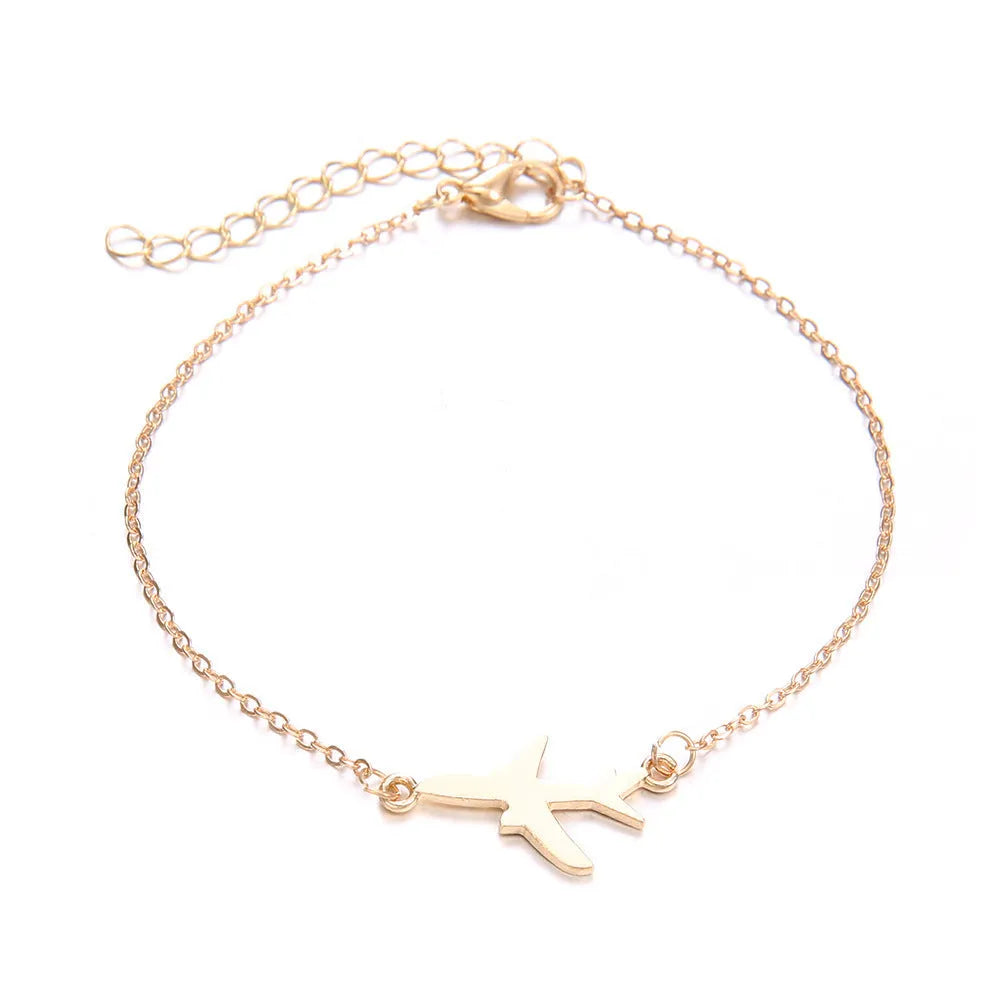 Set of three women's bohemian bracelets with heart-shaped aircraft map charms in alloy metal.