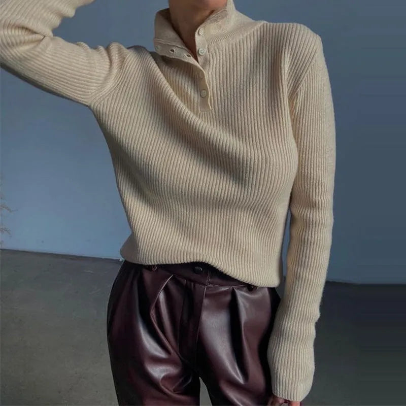 Slim fit silver grey half turtleneck sweater with a breasted button placket on a mannequin.
