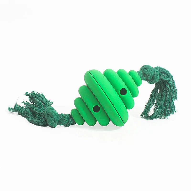 Green and yellow silicone dog ball with integrated rope, showing split spiral design for treat dispensing.