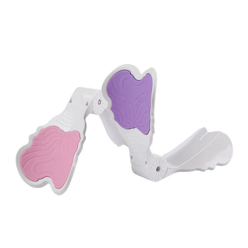 Pink hip trainer with silicone surface measuring 27cm by 9.5cm for pelvic floor and inner thigh exercises