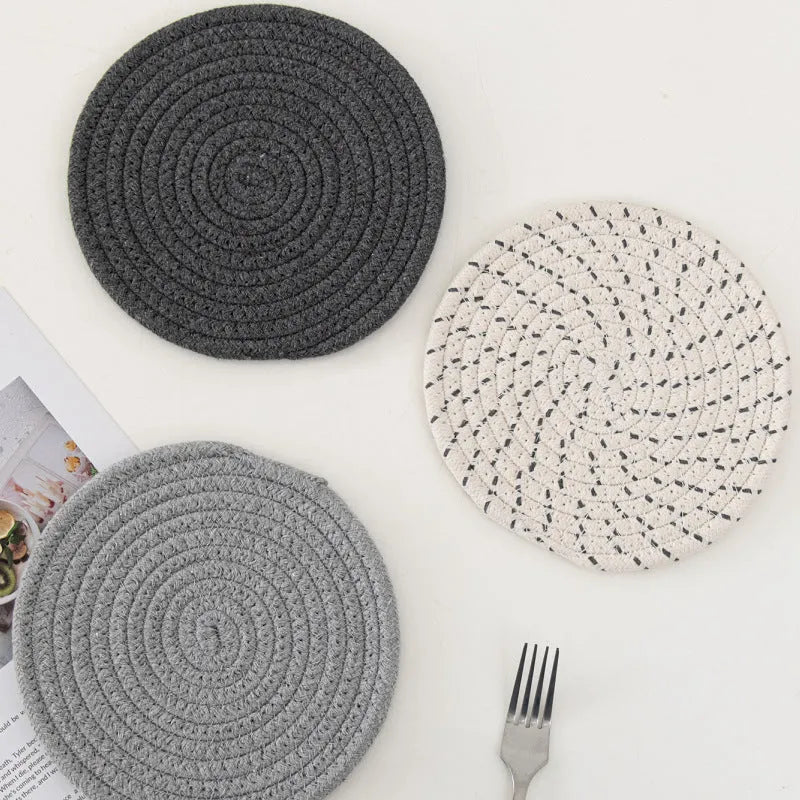Three round cotton cord coasters in blue colour showing 18cm diameter measurement