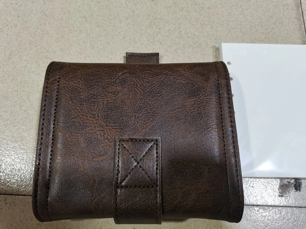 Brown A7 PU leather buckle notebook with loose-leaf binder binding on wooden surface
