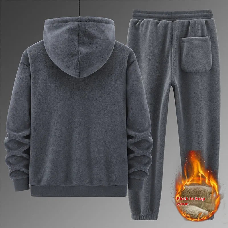Grey casual sports suit set featuring a hooded long-sleeve sweater and matching trousers on a hanger.