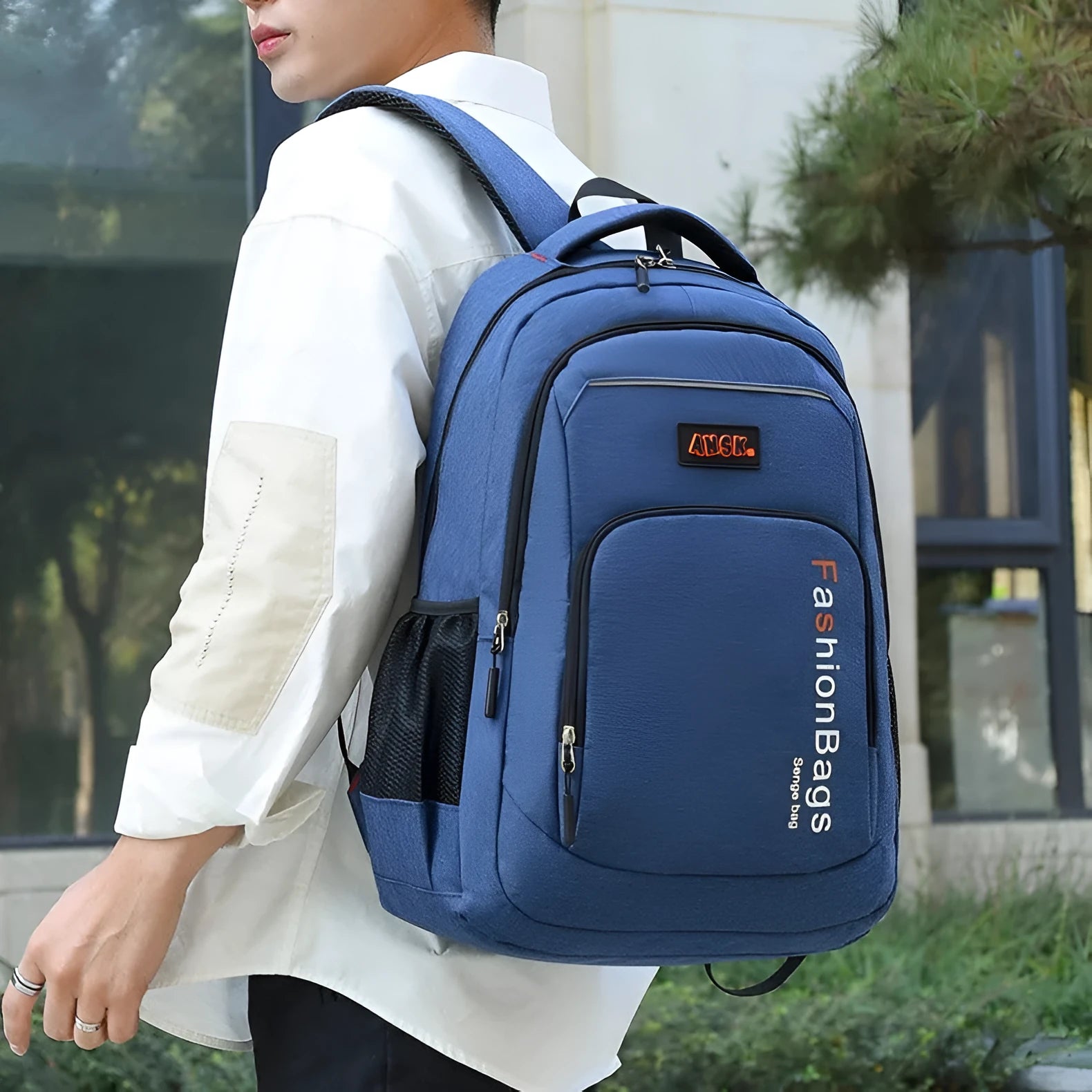 Nylon fashion backpack in blue showing dual shoulder straps, front zip, and multiple organisational compartments.