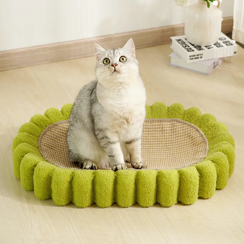 Green oval sisal cat scratch pad bowl serving as a cat bed and furniture protector.
