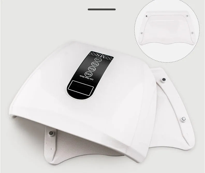 White 96W LED nail dryer with red light, 48 lamp beads, and removal base tray on a desk