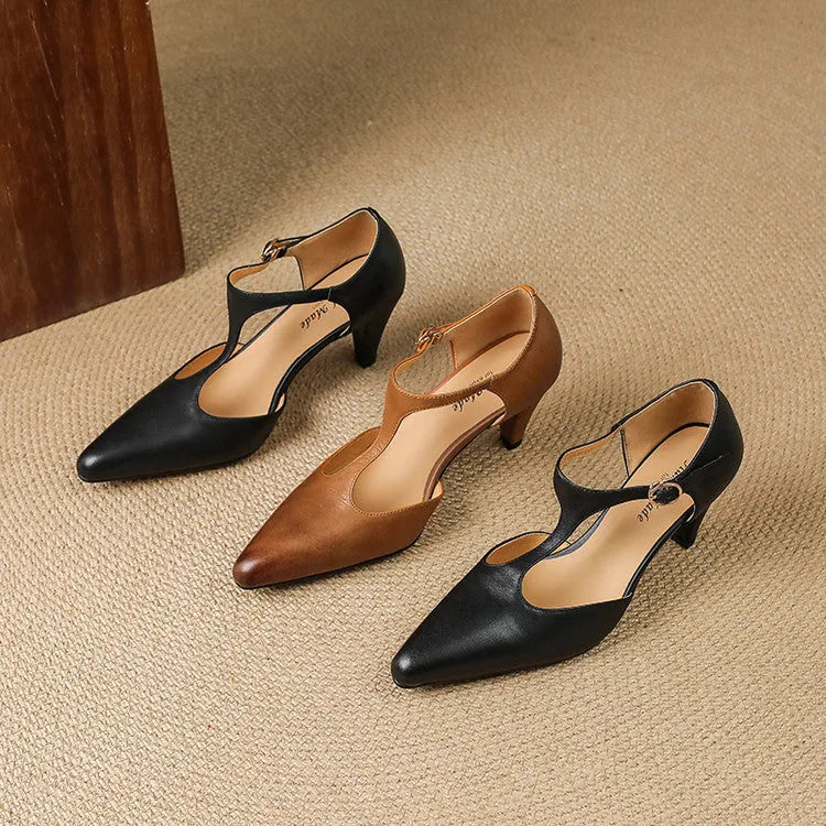 Brown retro women's sandals with a T-strap, buckle, closed round toe, and a short stout heel.