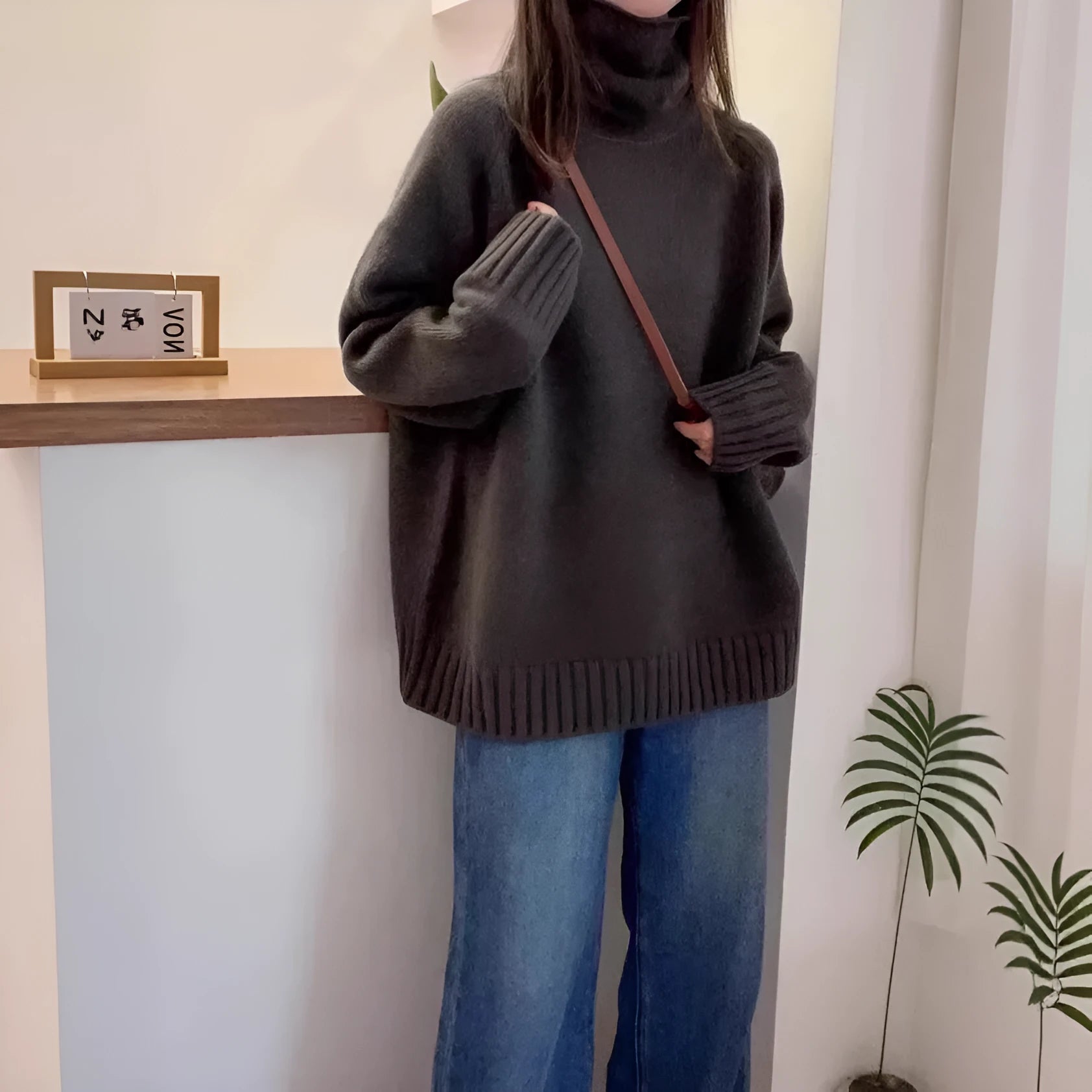 Women's loose turtleneck sweater with a thick curling pile collar in a choice of four colours.