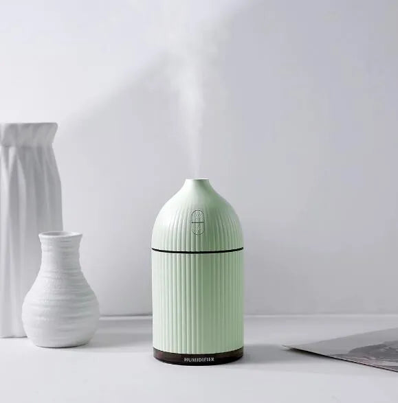 White ultrasonic aromatherapy diffuser and humidifier with LED light, 300ml capacity, and USB cable