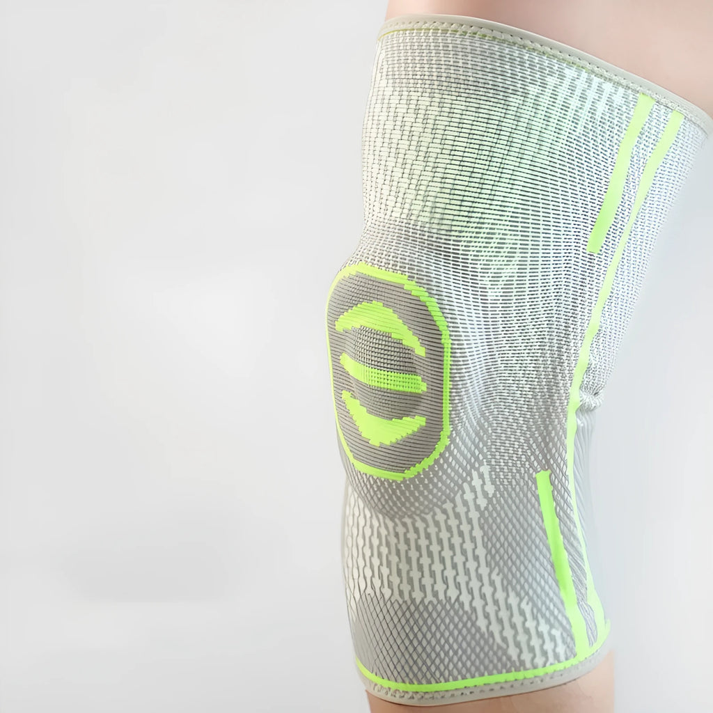 A cotton mountaineering knee pad in blue, shown on a knee.