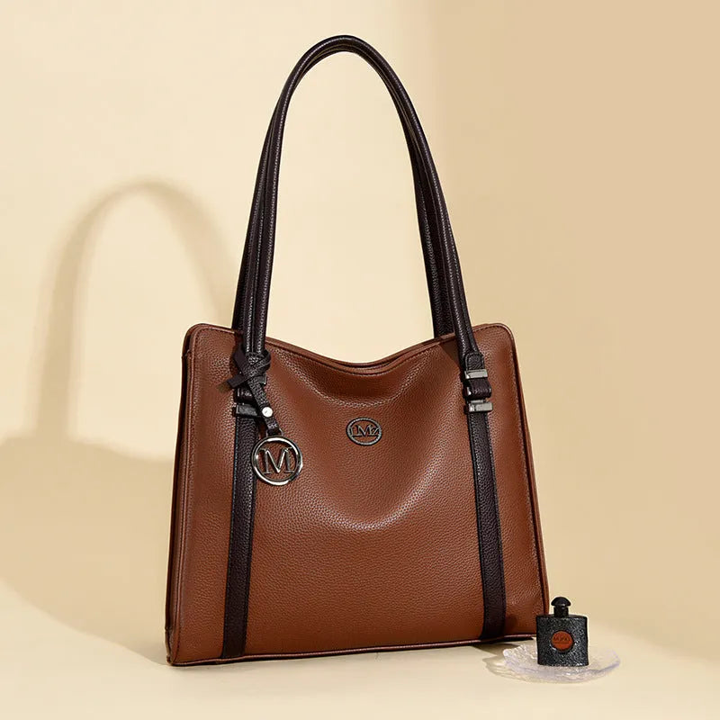 Women's large horizontal square crossbody bag in soft PU material, shown in wine red colour with double shoulder straps.