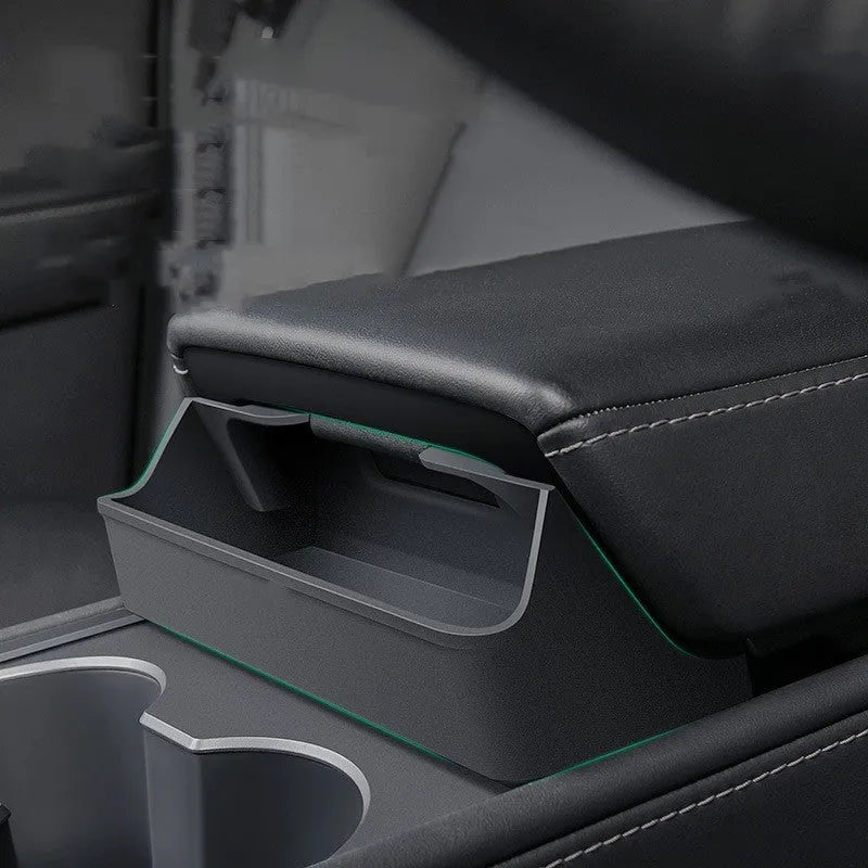Black silicone glasses case mounted in Tesla Model 3 or Y armrest compartment for organised storage
