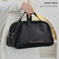 Large leather-look travel toiletry bag open showing compartments, in caramel mocha colour.