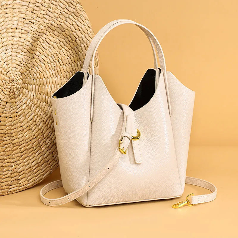 Genuine leather women's large capacity hand holding bucket bag in retro style.