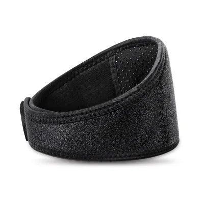 Black self-heating magnetic therapy neck guard with adjustable strap laid flat.