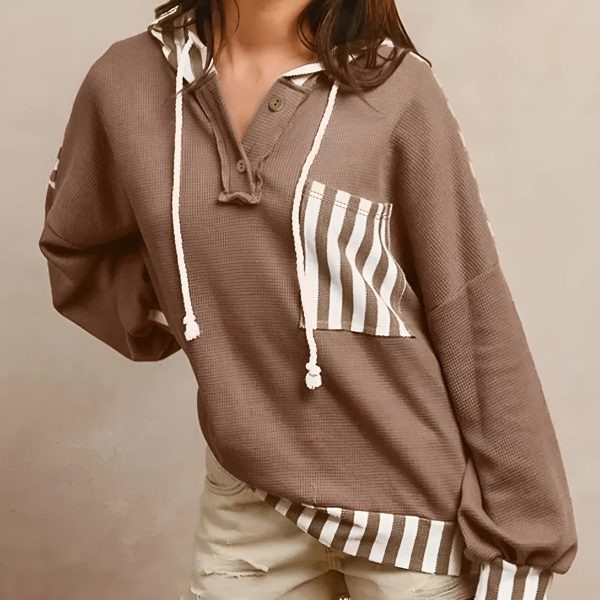 Straw yellow hoodie with waffle texture stripes and patchwork design featuring button neck and drawstring hood