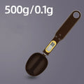 Black electronic measuring spoon scale with digital display on handle and integrated spoon bowl.