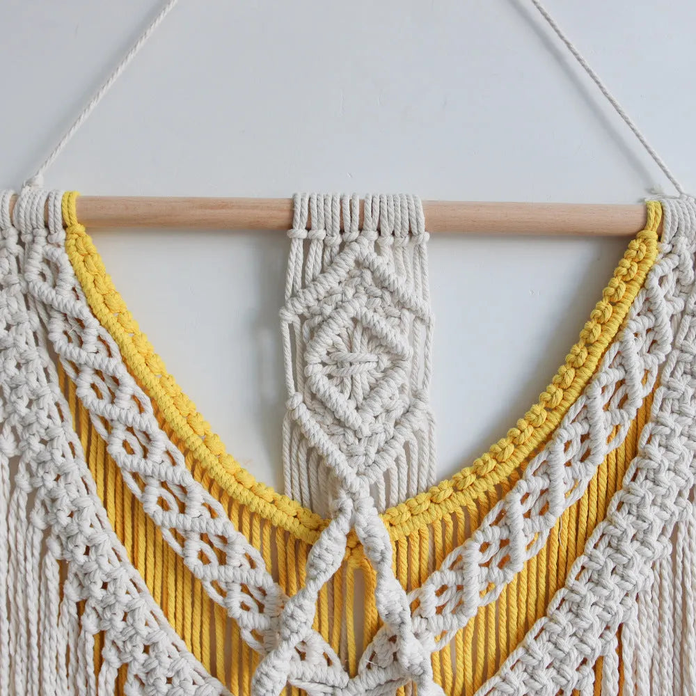 Hand-woven cotton Nordic tapestry wall hanging with creamy white and yellow colours