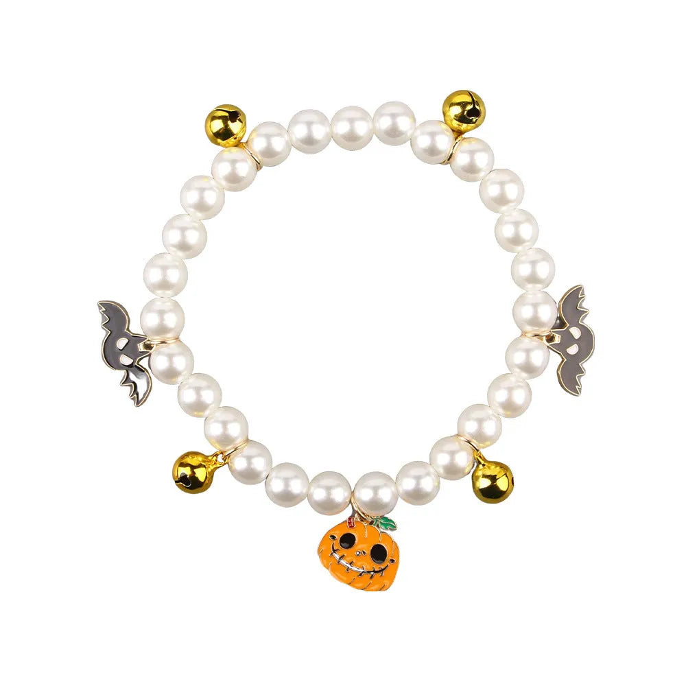 Halloween cat collar with pearl necklace decoration showing three pumpkin design variations