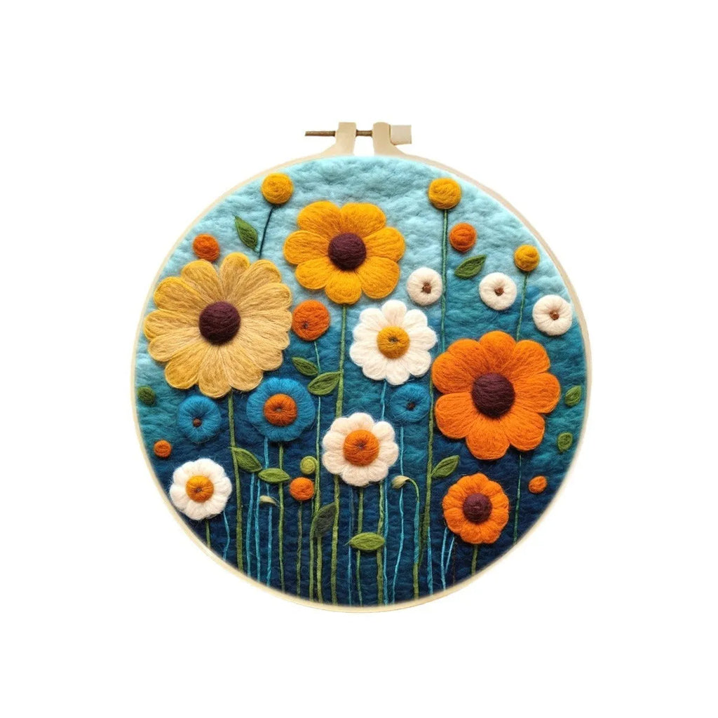 Round three-dimensional wool felt embroidery on linen with floral pattern in embroidery frame