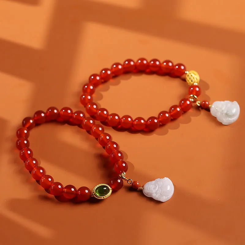 Red agate bracelet with amber accents and geometric Maitreya Buddha charm