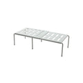 White telescopic plastic kitchen rack extended to 69cm height on kitchen countertop