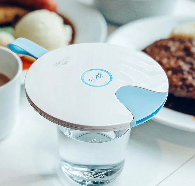 A slim, portable UV-C baby bottle steriliser in blue, showing its compact size and USB port.