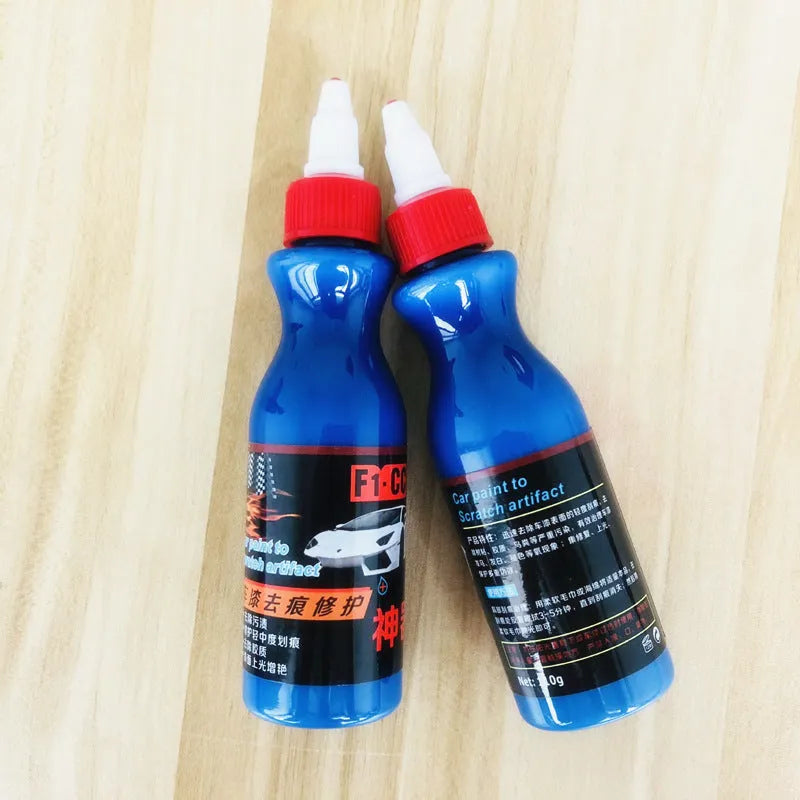 Small blue car scratch repair tool with applicator for automobile surface treatment
