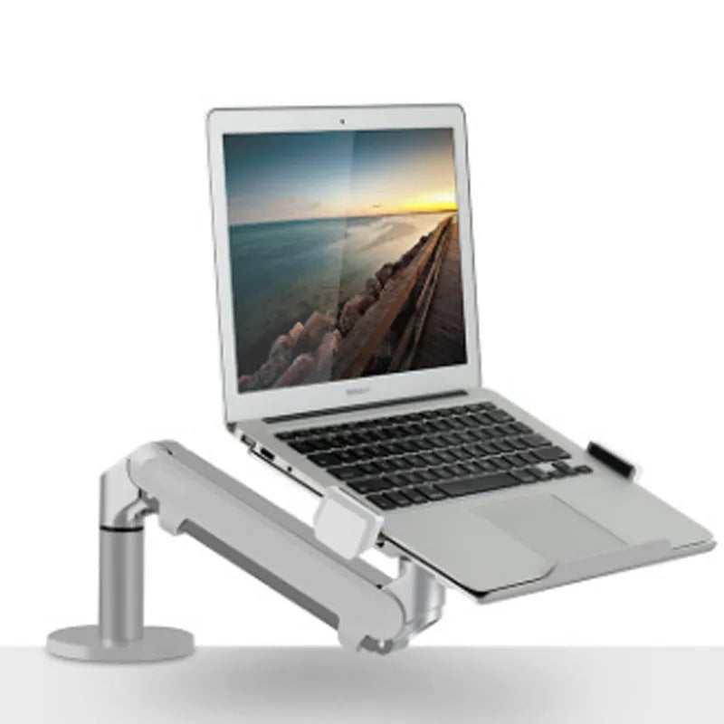 Silver aluminium alloy Free Hover laptop stand with adjustable air pressure arm on a desk.