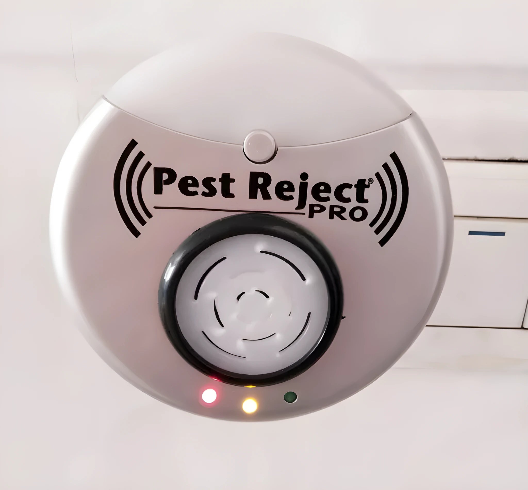 Silver grey intelligent ultrasonic mosquito repellent measuring 10cm, plugged into a white wall socket for indoor pest control