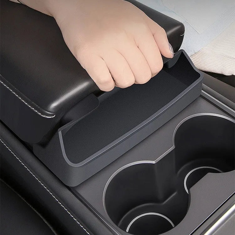 Black silicone glasses case mounted in Tesla Model 3 or Y armrest compartment for organised storage