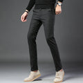 Men's slim casual trousers in polyester fibre, available in black, blue and grey, sizes 28 to 38.