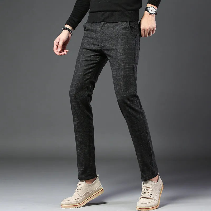 Men's slim casual trousers in polyester fibre, available in black, blue and grey, sizes 28 to 38.