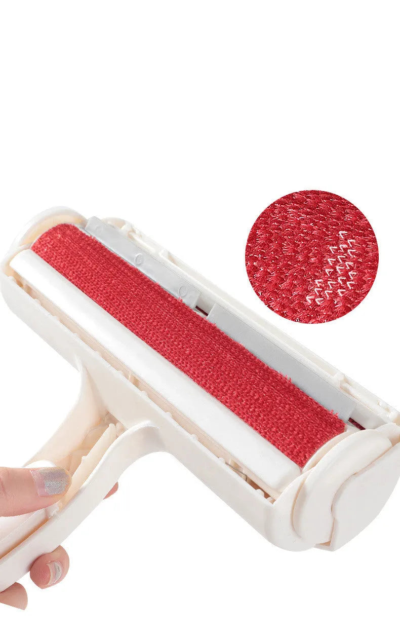 White plastic roller brush for pet hair removal on fabric surface