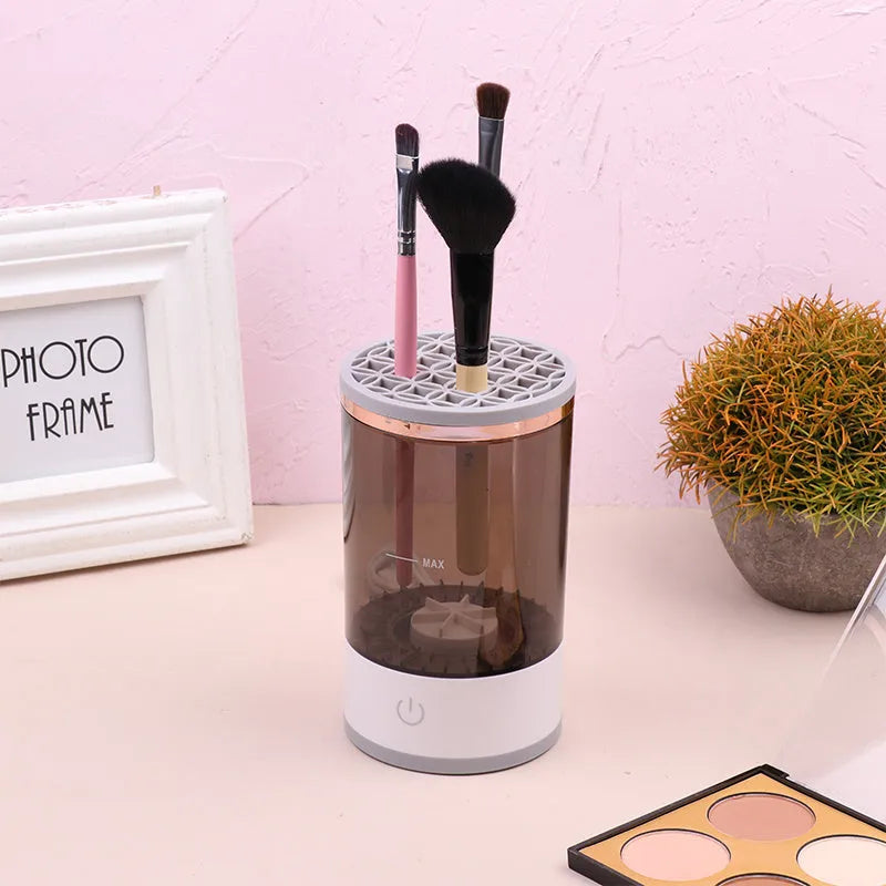 Electric makeup brush cleaner in grey and white, 17x9x9 cm, with USB charger and brush