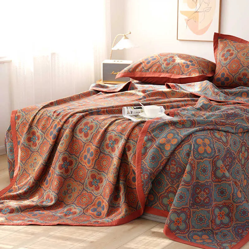 Cotton gauze bedding three-piece set showing botanical flower pattern on blanket and matching pillowcases