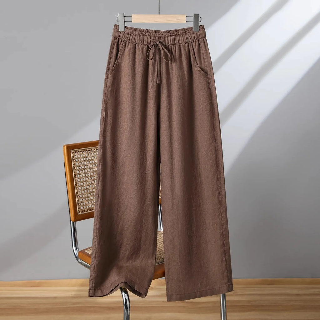 Women's straight leg casual trousers with a drawstring elastic waist in apricot colour.