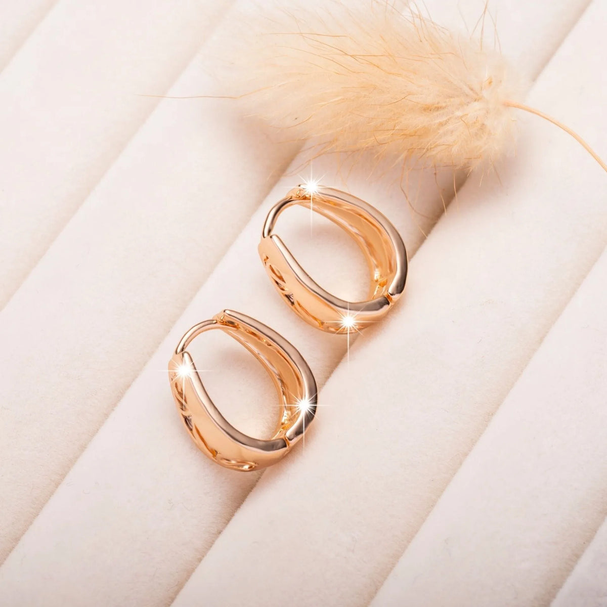 Rose gold U-shaped hollow carved women's earrings made from electroplated copper, one pair.
