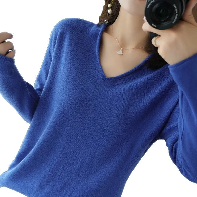 Women's grey V-neck long sleeve knitwear pullover on a hanger