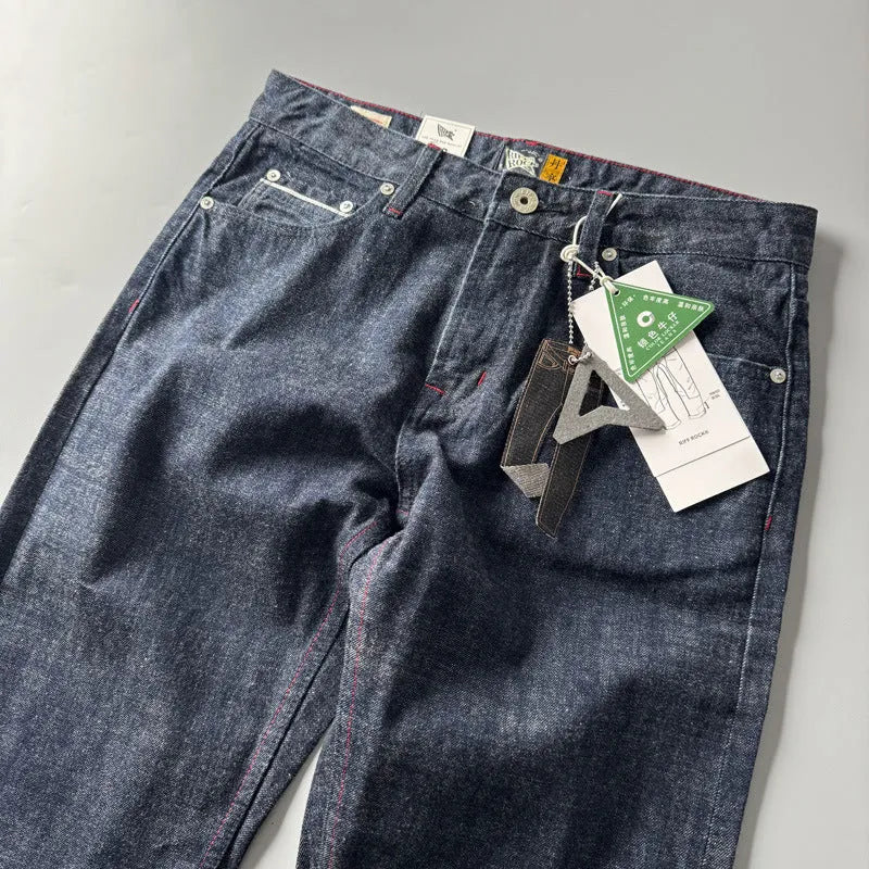 Men's primary colour American retro straight-leg denim trousers laid flat, showing mid-waist and full-length cut.