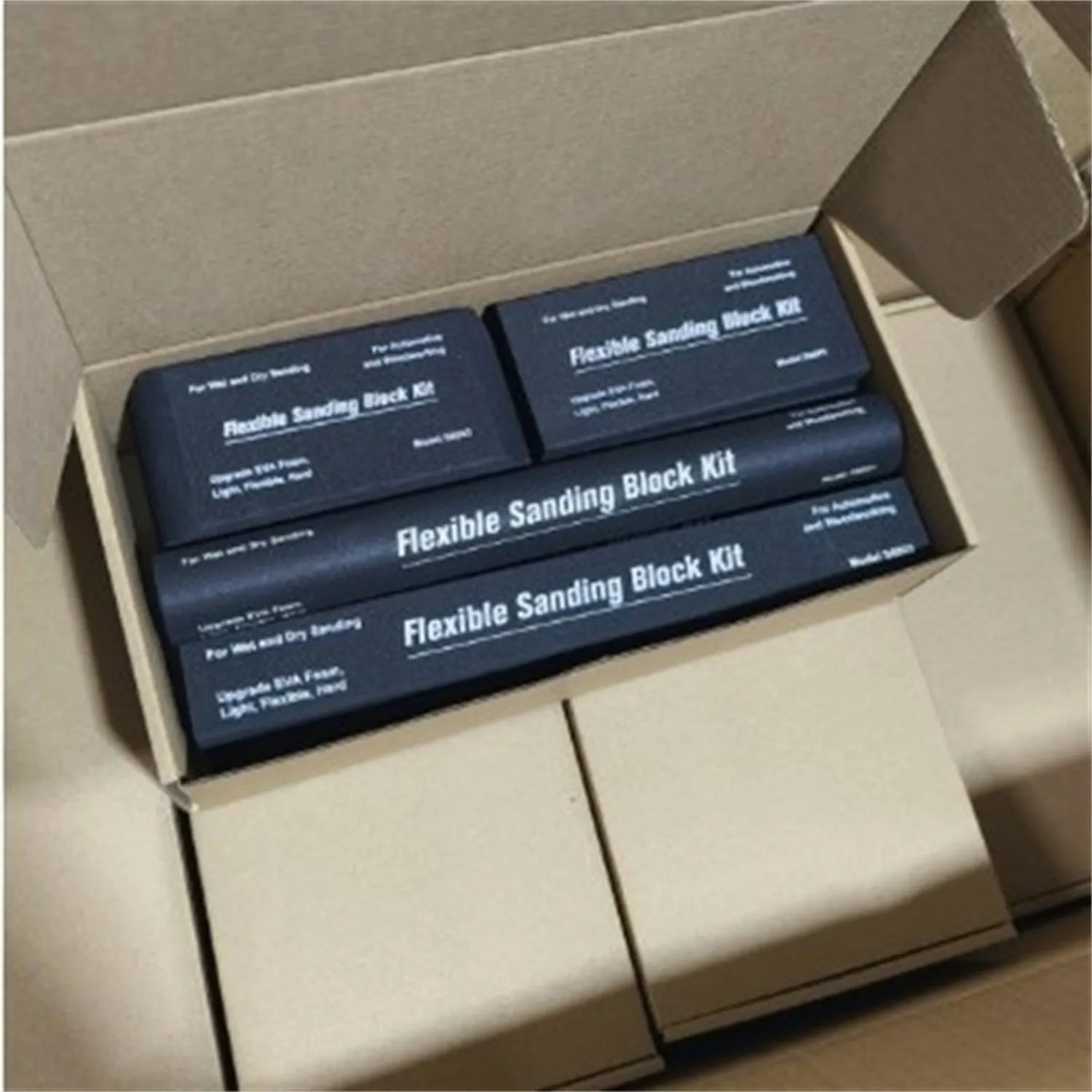 Set of seven black metal EVA frosted building blocks arranged together