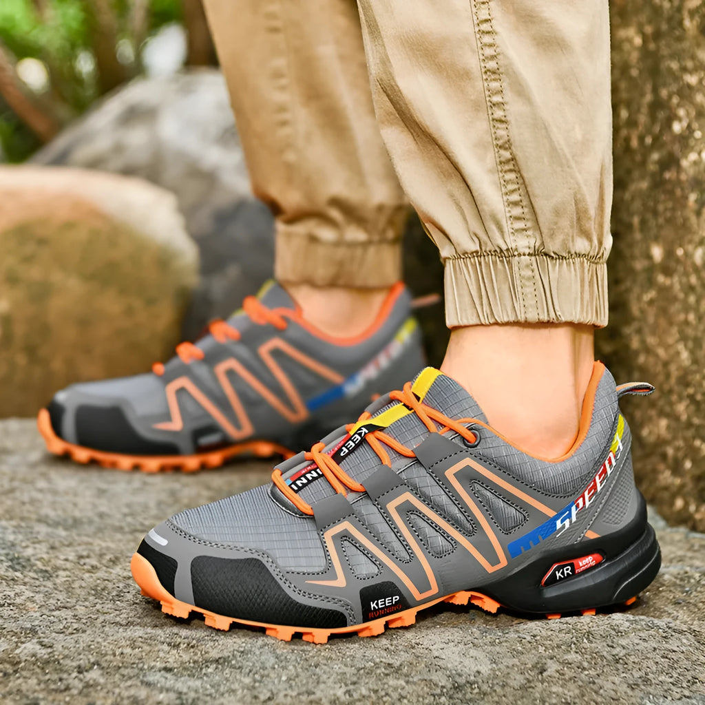 Men's grey orange plus size casual running shoes with synthetic leather upper and rubber sole.