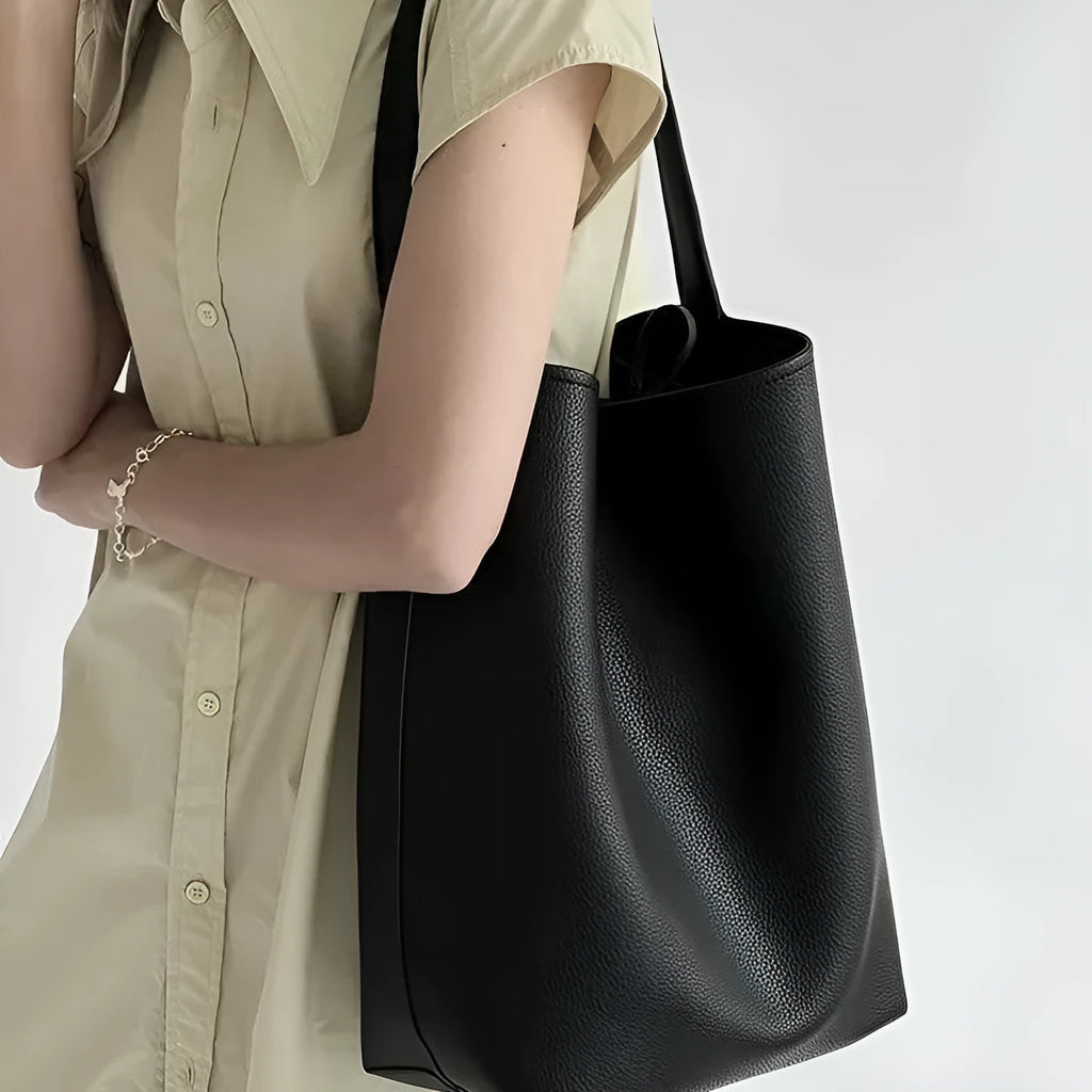 Casual PU shoulder bag for women with visible sewing thread detail in black