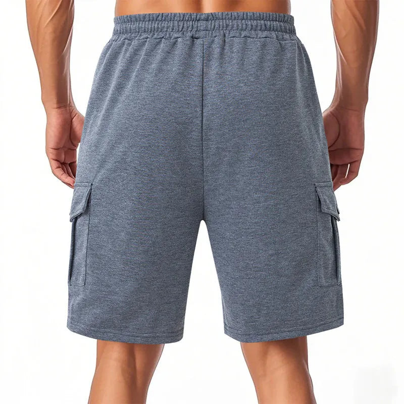 Loose fit sports cargo shorts with multiple pockets in light grey, showing elastic waistband and fifth pants length
