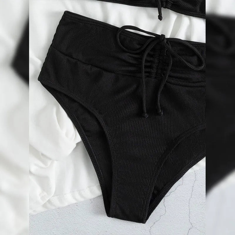 Black high-waisted women's bikini swimsuit with sling split design