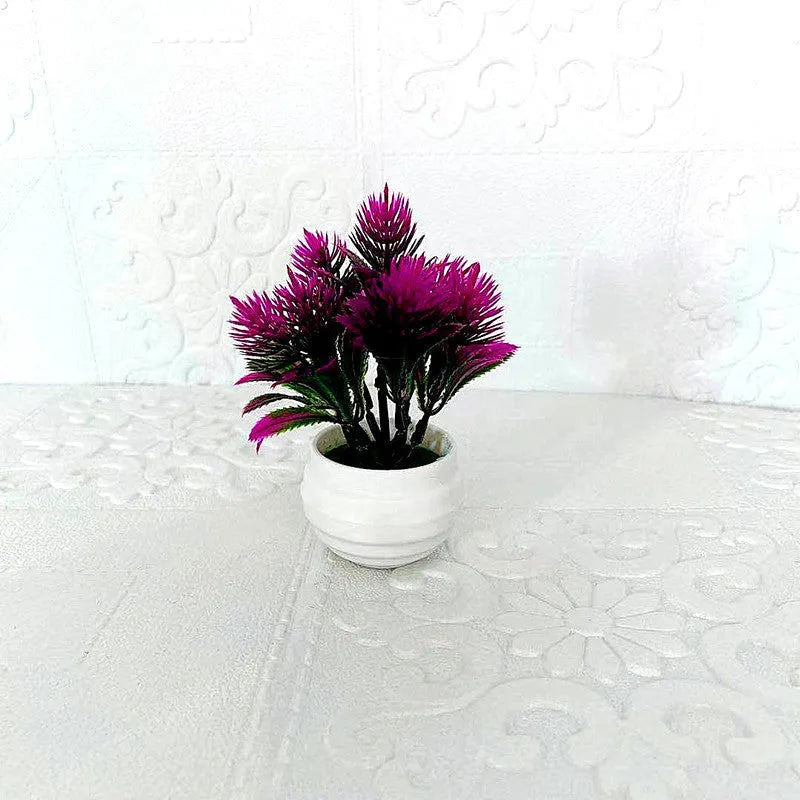 Simulated bonsai potting ornament in green plastic with bonsai shape on white background