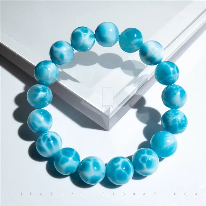 Blue Bodhi bracelet with pearl elements, showing Maillard style and range of bead sizes.
