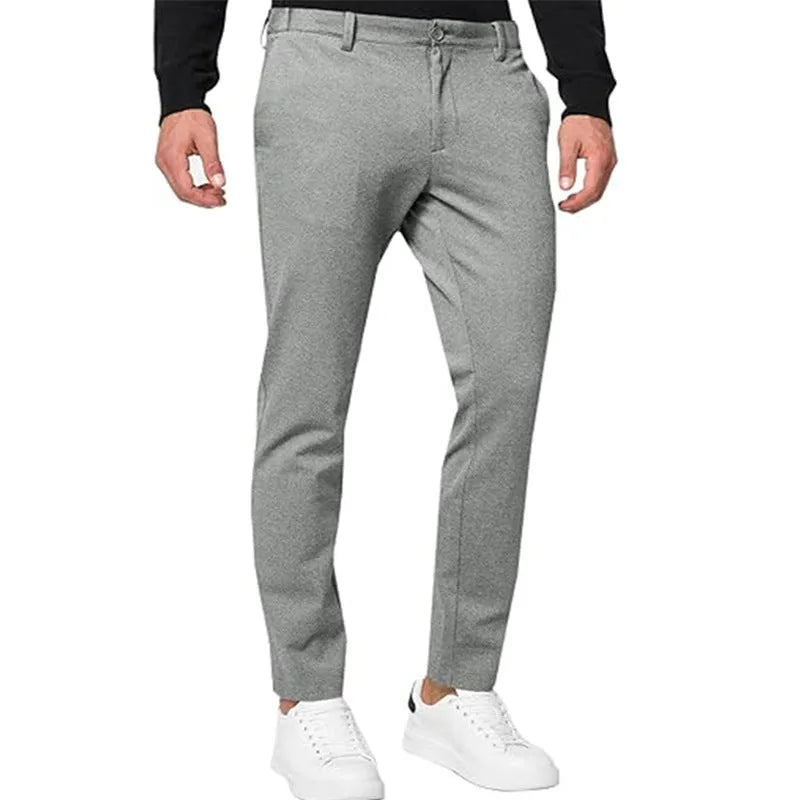 Men's slim-fit tapered chino trousers in a solid colour, showing the tapered leg and casual style.